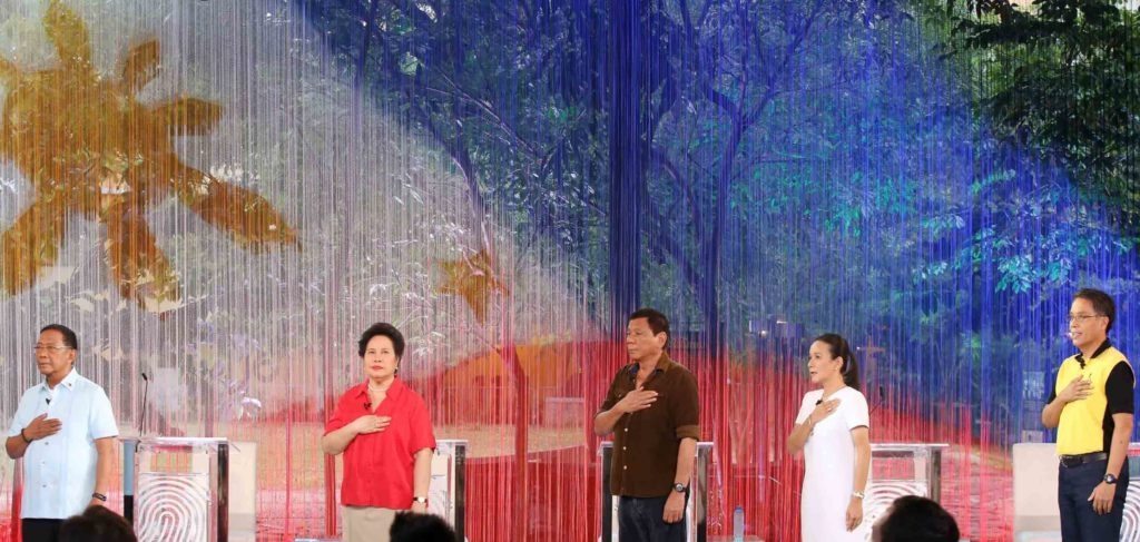 The five presidentiables (L-R) VP Jejomar Binay, Senator Meriam Defensor Santiago, Mayor ROdrigo Duterte, Senator Grace Poe and Mar Roxas, sings the Philippine NAtional Anthem after they were introduced before the start of the Pilipinas Debate 2016 at the Phinam University of Pangasinan in Dagupan City, April 24, 2016. (MArk Balmores)